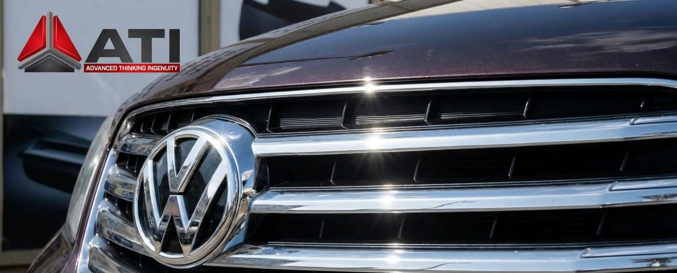 Close-up of a luxury car front grille with chrome-plated finish, showcasing the metallic appearance of ABS plastic parts